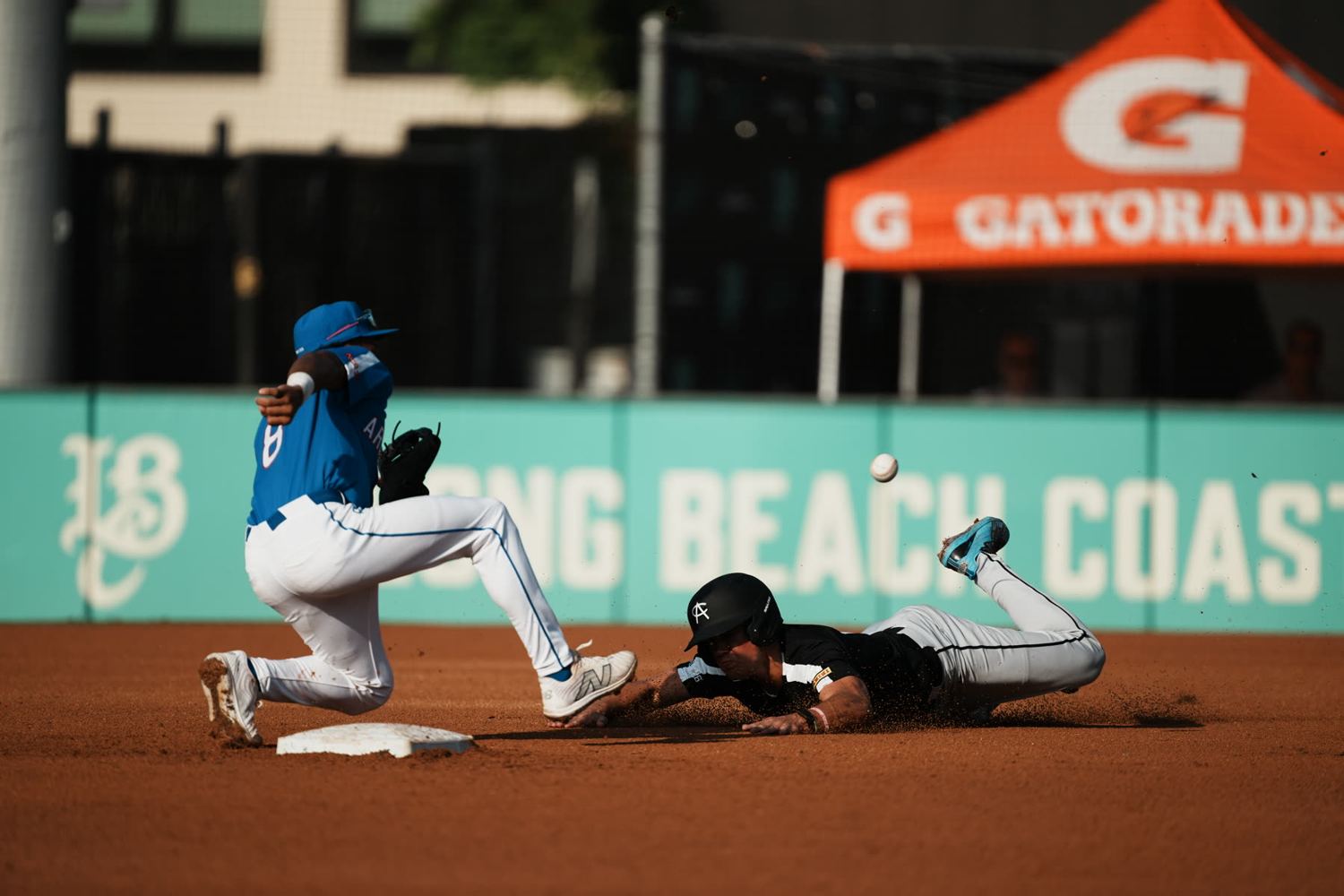 Runner sliding into second base
