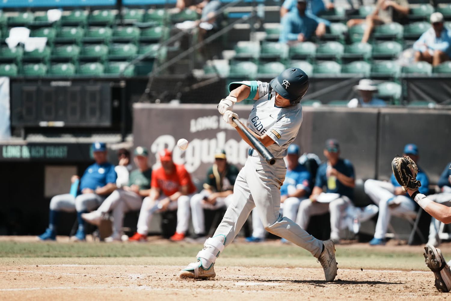 Batter finishing a swing at the Area Code Games