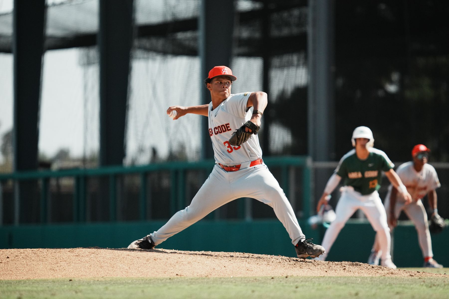 Pitcher mid-delivery at the Area Code Games