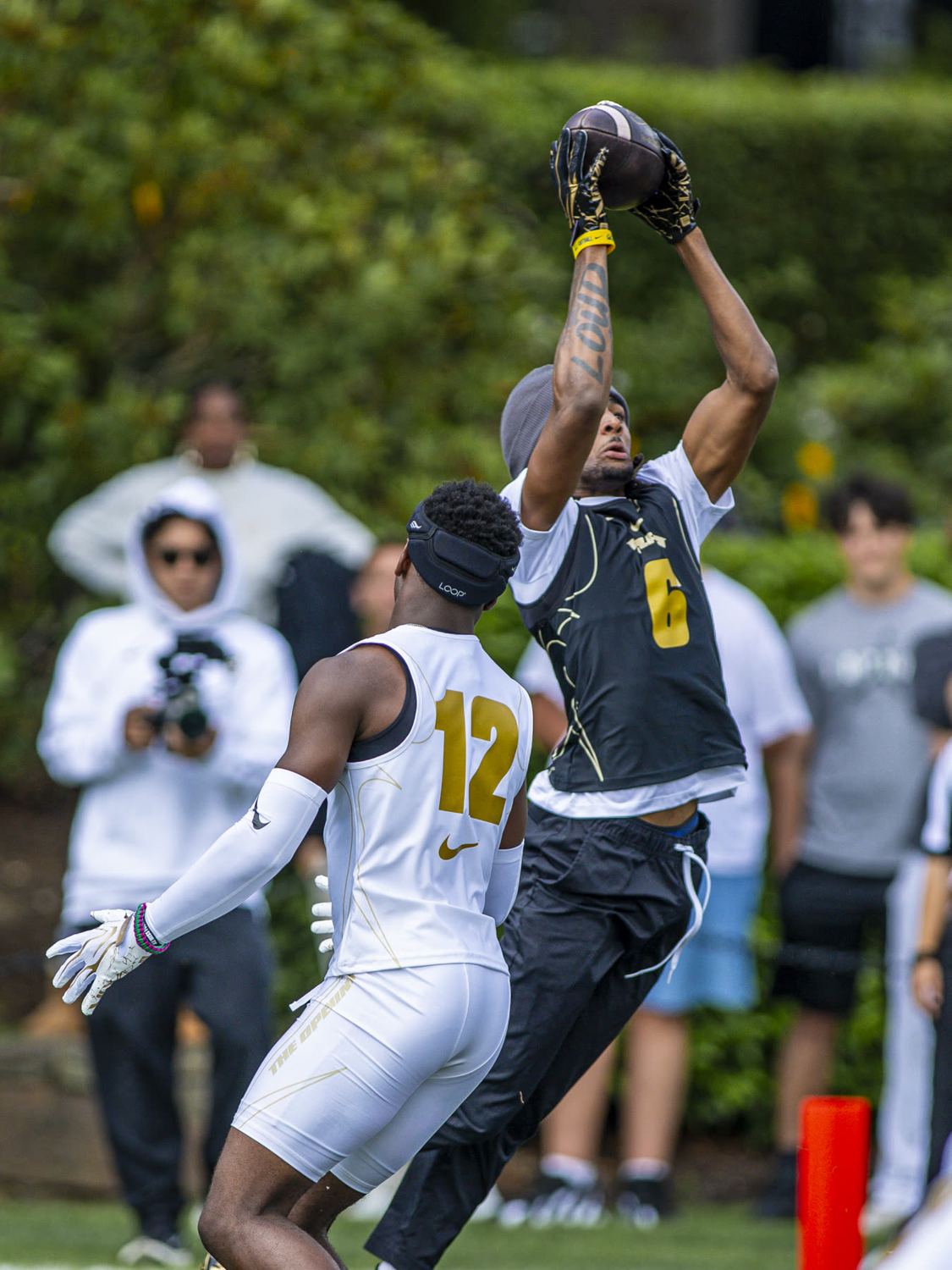 Receiver going up for a catch at The Opening
