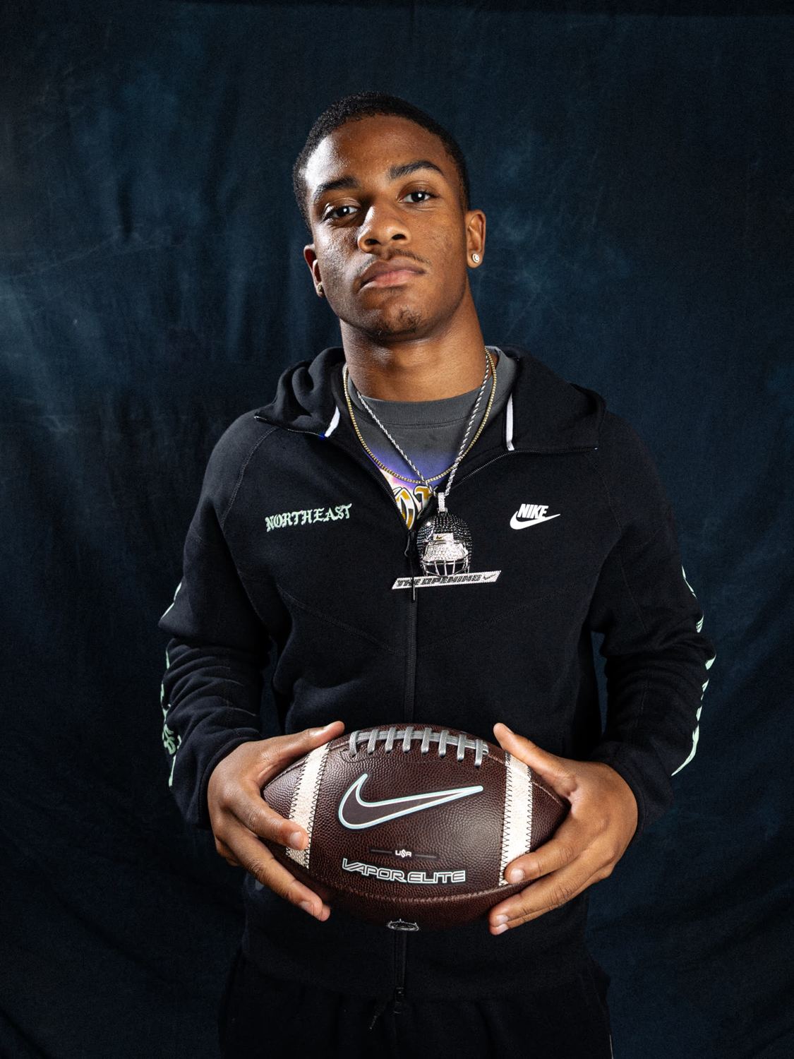 Athlete portrait with a Nike football